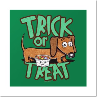 Funny and cute doxie dachshund dog going trick or treating on halloween to get more candy on a scary and spooky night Posters and Art